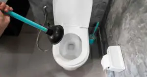How to Unclog a Toilet That's Backing Up into the Bathtub?